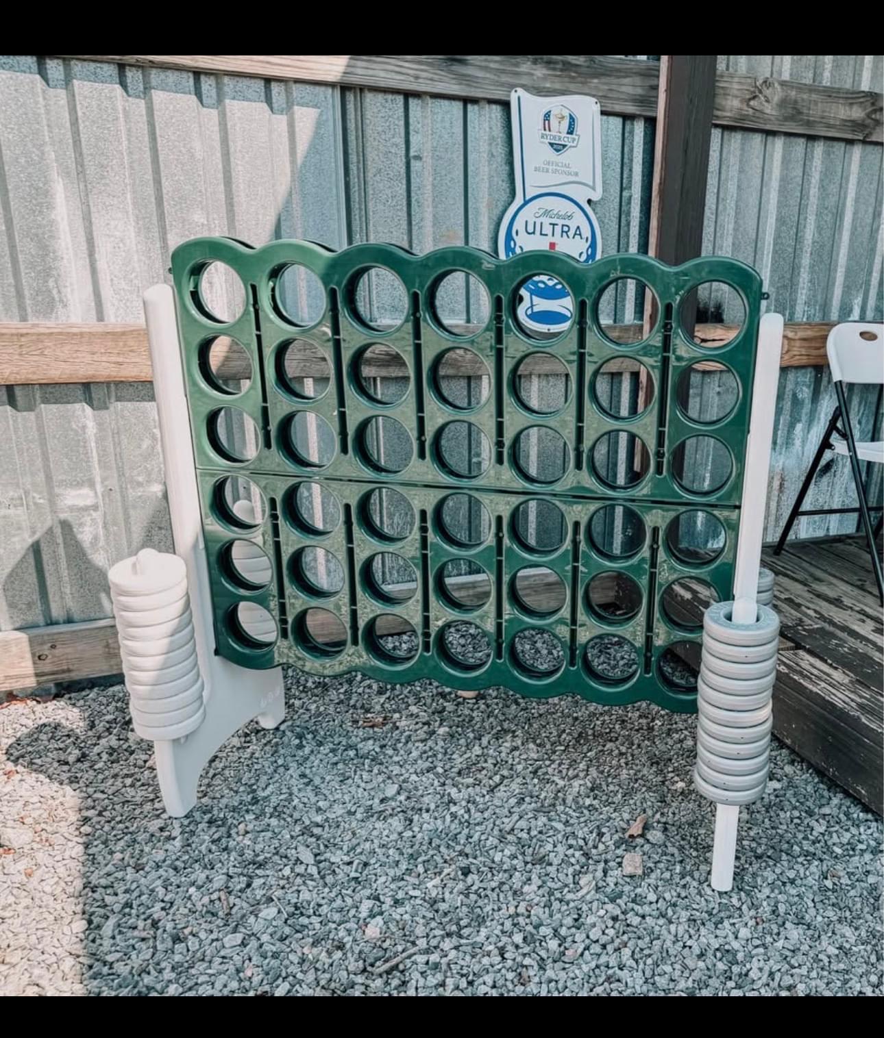 Giant green, white, and silver connect four game rented out at an outdoor event in Park Hill, Oklahoma